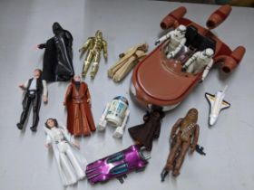 A collection of Star Wars toys to include C3PO, R2D2, Obi Wan Kenobi, Darth, and others, together