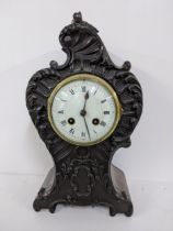 A late 19th century mahogany mantel clock the case carved with C scroll and the Japy Freres 8-day