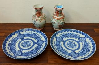 A pair of early 20th century Japanese Imari plates and a pair of vases decorated with a dragon,