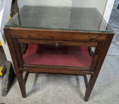 A 1930's oak display cabinet with a later glass top and hinged panelled sides, on square legs, 68.