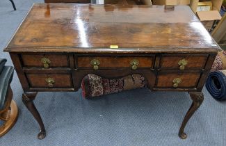 An early 20th century Queen Anne style walnut veneered desk , 77cm h x 106cm w, and a matching stool