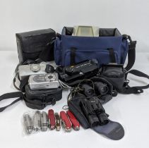 A mixed lot to include a Canon auto zoom 318m and others together with binoculars and pen knives