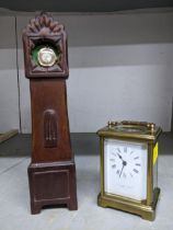 A brass case five window carriage clock, white enamel roman dial marked with retailers name L.N.