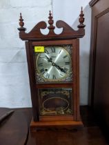 A highlands mahogany cased wall hanging clock, the silvered Roman dial marked Highlands glazed