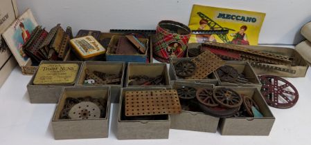 Meccano to include a clockwork motor, instructions, wheels, brackets, nuts and bolts, and other