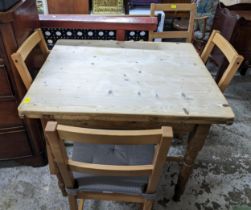 A late Victorian pine kitchen table minus a drawer and a set of four beech chairs Location: