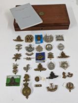 A quantity of early to mid 20th century British Army cap badges to include Royal Artillery