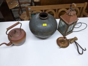 A selection of metal ware to include an African water carrier metal bowl, copper porch light with