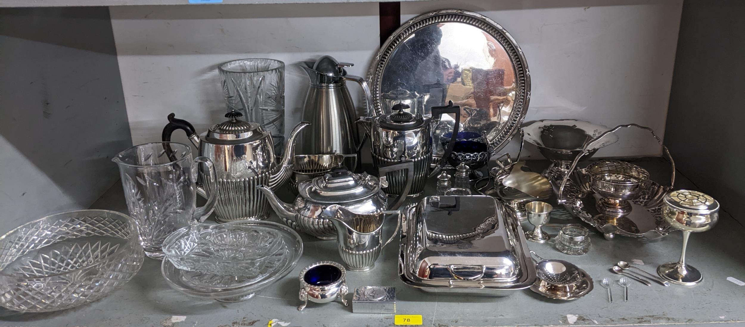 A mixed lot of silver plate and cut table glass to include a three piece tea set, circular tray