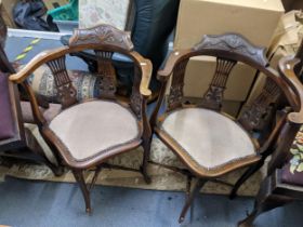 A pair of late 19th/early 20th century mahogany pierced splat back salon armchairs Location: