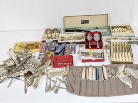 A quantity of silver plated cutlery and flatware mostly boxed together with collectors spoons and