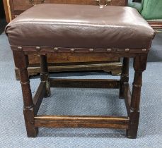 A 17th century and later oak stool having a leather top and turned legs, 54h x 53w, Location: