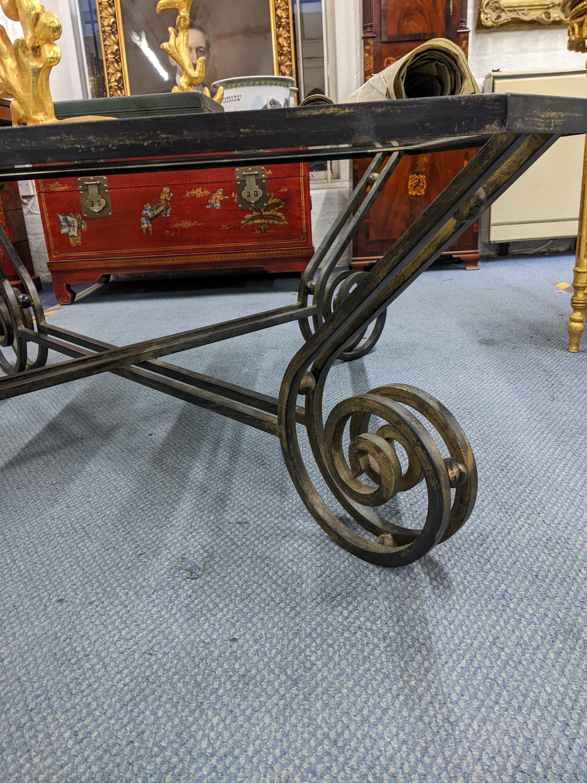 A contemporary glass topped and wrought iron coffee table 45x110x110cms Location: RAM - Image 2 of 2