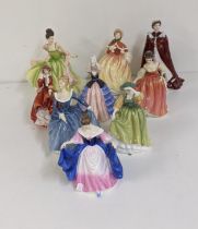 A group of Royal Doulton figurines to include 'Buttercup', 'Fragrance' and other together with Royal