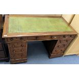 A Victorian walnut twin pedestal desk having a green leather top and nine drawers, 75h x 119.5w,