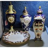 Royal Crown Derby china to include two plates, a lidded vase, a vase and a lidded hand painted vase,