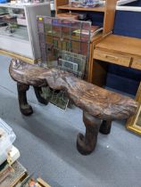A 20th century carved hardwood two seat bench, fashioned as two fish on shaped legs, 63cm h x
