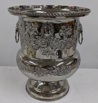 A silver plated wine cooler with embossed decoration and lion mask ring handles, Location: