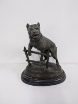 A late 20th century cast bronze model of a dog on a rocky base, signed Calton, Location: