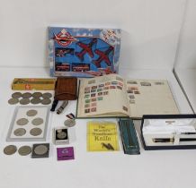 A mixed lot to include a stamp album part filled with around the world stamps, a Metropolitan Police