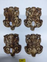 A group of four Chinese white jade plaques denoting the four seasons, in the form of flattened