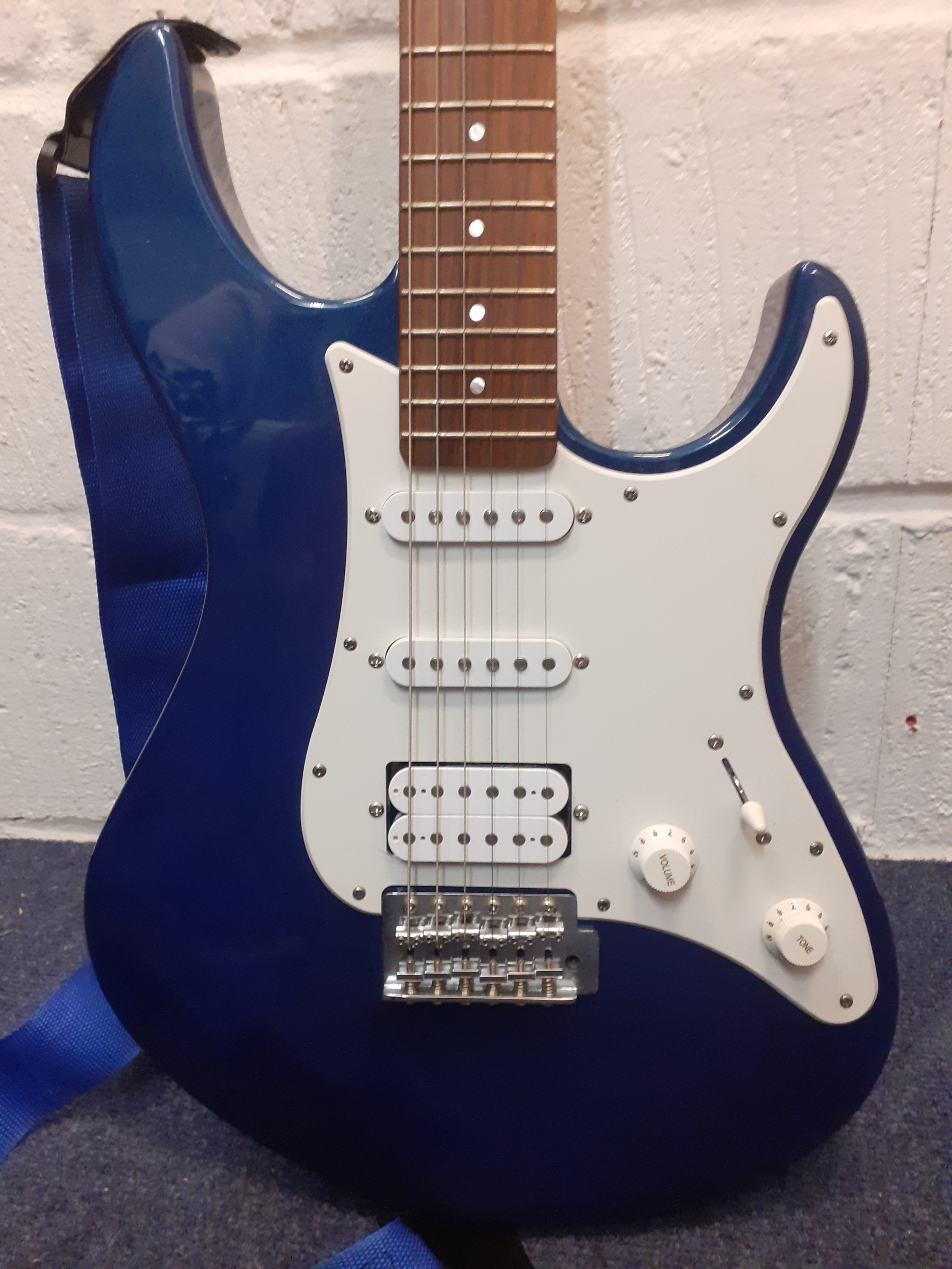 A Yamaha Pacifica 012 6-string electric guitar, made in Indonesia in blue with additional shoulder