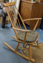 A blonde Ercol Goldsmith rocking chair with an attached brown cushion, Location:
