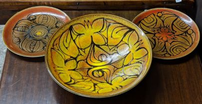 Poole pottery to include a large Aegean bowl and two wall plates Location: