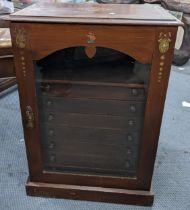 An early 20th century specimen/collectors cabinet having a glazed door, shelf and seven drawers,