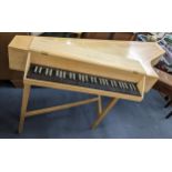 A modern part built harpsichord in a light wood frame, 83cm x 174cm Location: