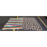 One blanket decorated in a crown and brown lattice pattern and multicoloured Navoh flat wool Kelim