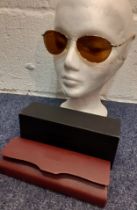 A pair of Oliver People's gold tone sunglasses having brown polarized lenses with branded case,