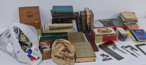 A mixed lot to include mixed books and a quantity of matches, vintage set squares and other items,