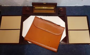 A late 20th Century Swaine Adeney Brigg brown leather folio with zipped sides to convert into a desk