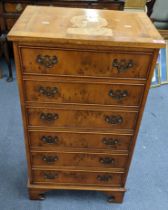 A reproduction yew chest of six short drawers on bracket shaped feet 94.5h x 52w Location: