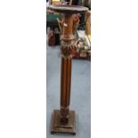 An early 20th century mahogany torchere stand having a reeded column and a stepped base 121.5h x 26w