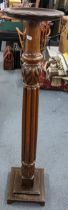 An early 20th century mahogany torchere stand having a reeded column and a stepped base 121.5h x 26w