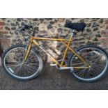 A Palomar gold coloured GT mountain bike Location: G