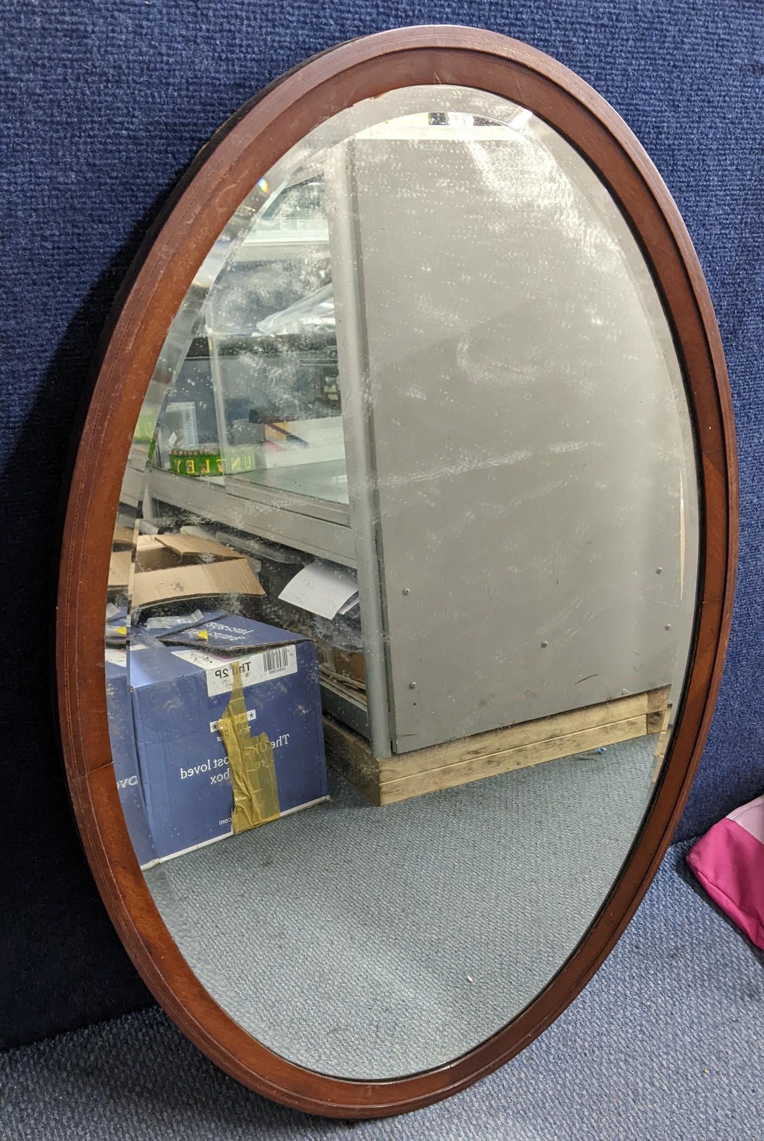 An inlaid mahogany Edwardian oval mirror, 88h x 58w, Location: