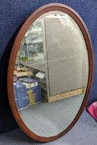 An inlaid mahogany Edwardian oval mirror, 88h x 58w, Location: