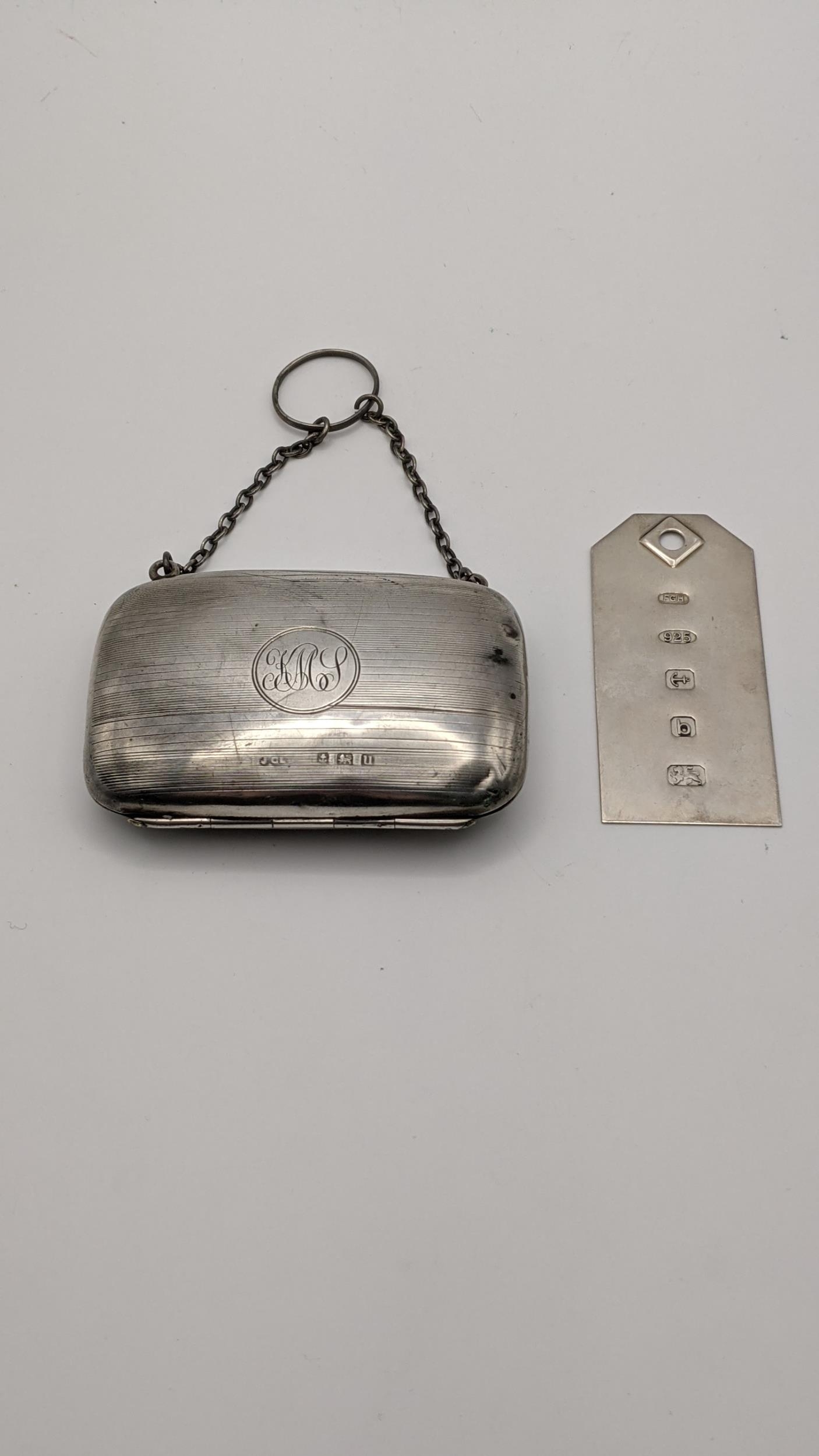 A silver coin case hallmarked Birmingham 1919, together with a silver ingot pendant total weight