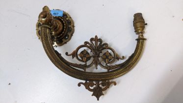 An art nouveau brass folding wall light with flower ornament, 26cm h x 35cm w Location: