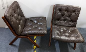 A pair of 1970's Ekornes Uno folding chairs with brown button leather upholstery Location: