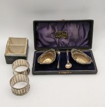 Silver to include a pair of salts boxed hallmarked Birmingham 1899, together with a pair of napkin