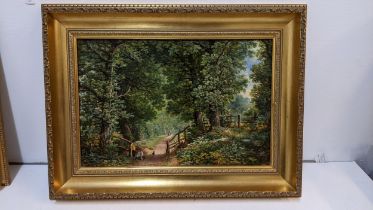 Attributed to Reynold George Jennings - a woodland scene with a couple and a dog on a path, oil on
