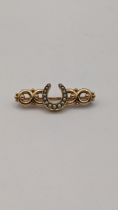 A yellow metal and pearl horseshoe bar brooch 4.3g Location: