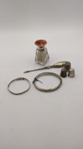 Mixed silver to include two bangles having engraved detail, dressing table bottle having a silver