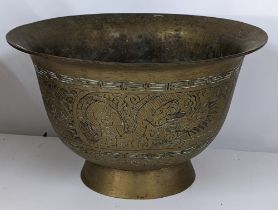 A large Chinese gilt metal engraved bowl, six-character marks to the base Location: