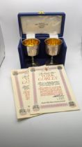 A pair of Barker Ellis Silver company goblets hallmarked Birmingham 1970, Engraved with a crest in a