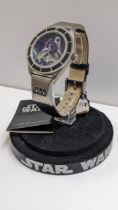 A Star Wars limited edition Fossil watch, on a watch stand Location: